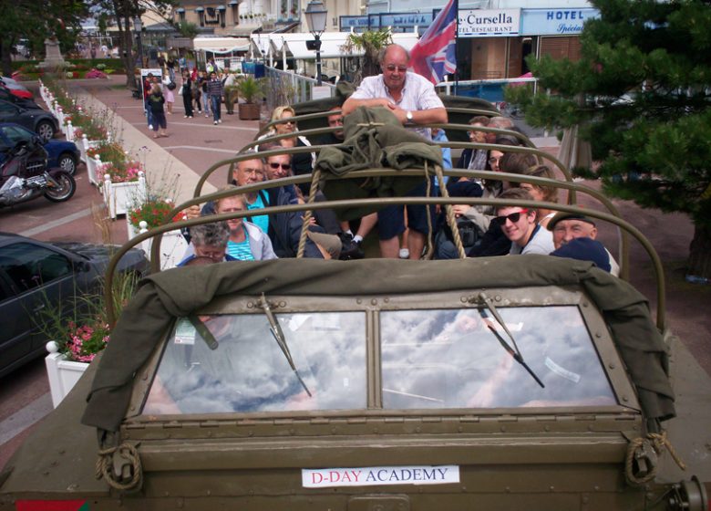 Groupe à bord d'un véhicule militaire ancien